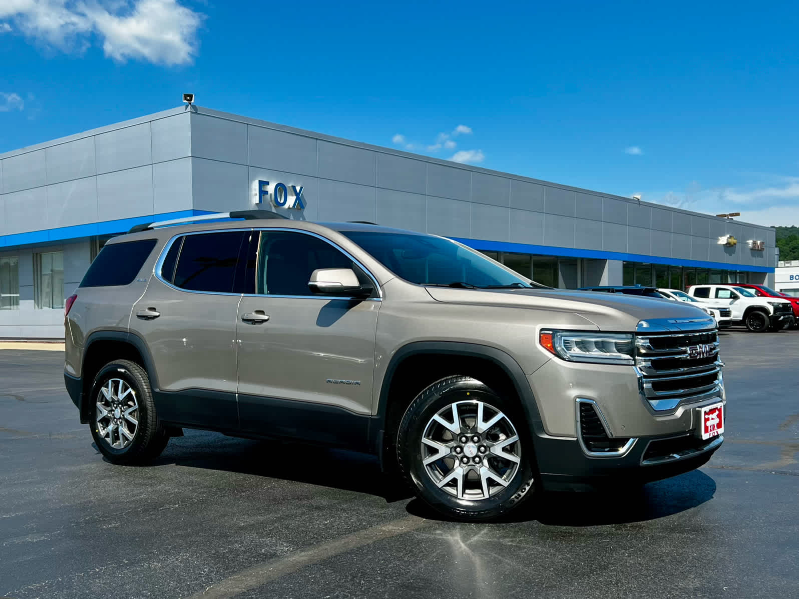 2022 GMC Acadia SLE in Light Stone Metallic — front three-quarter view
