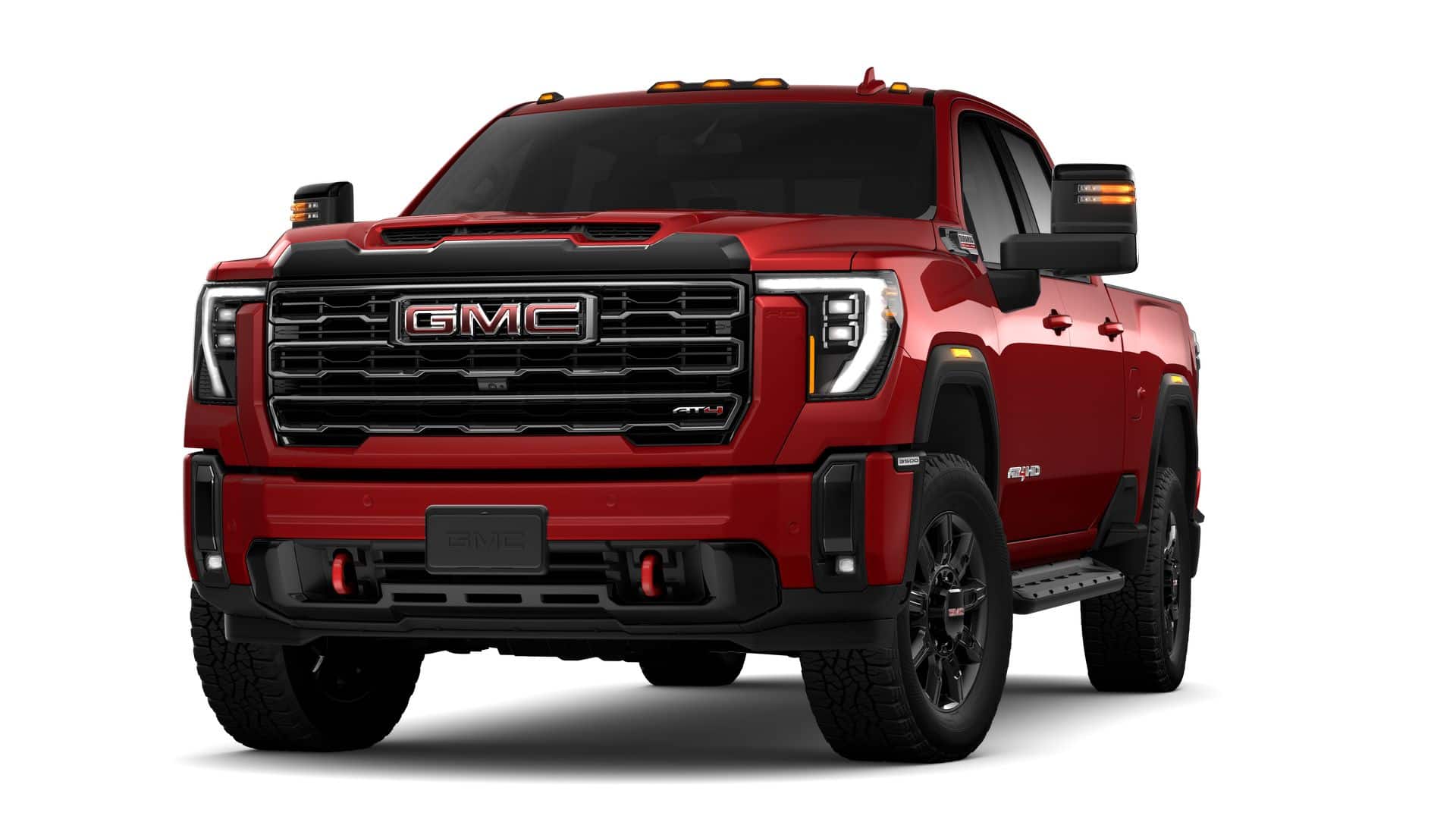 2026 GMC Sierra 3500 HD AT4 in Volcanic Red Tintcoat — front three-quarter view