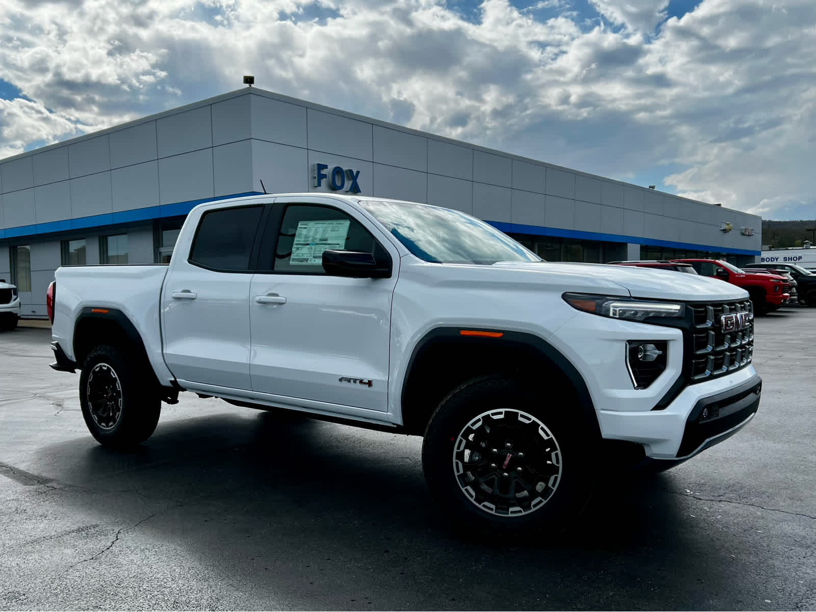 2026 GMC Canyon AT4 in Summit White — front three-quarter view