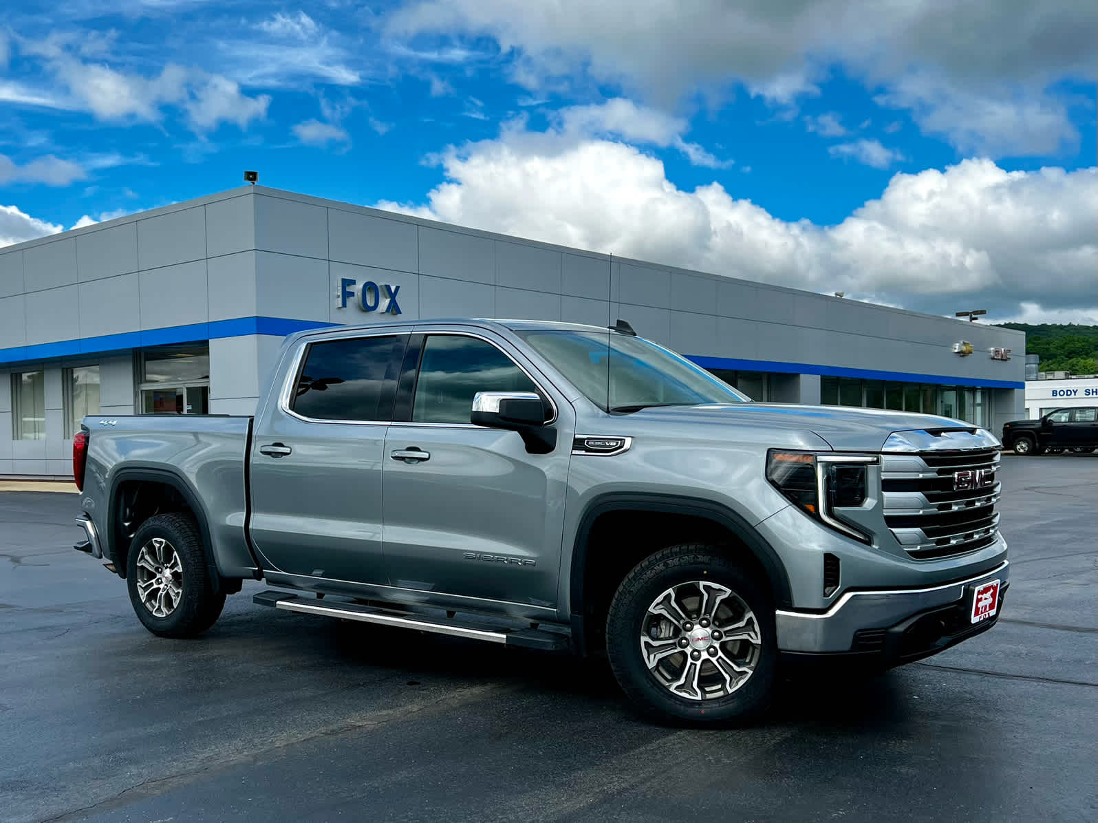 2025 GMC Sierra 1500 SLE in Sterling Metallic — front three-quarter view