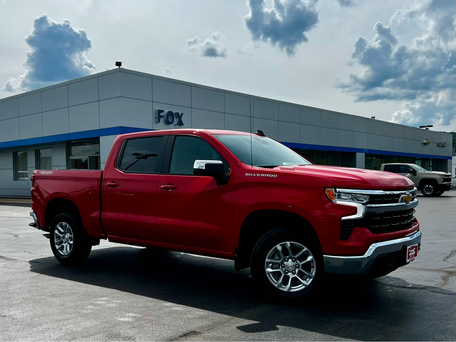 2026 Chevrolet Silverado 1500 LT (2FL) in Red Hot — front three-quarter view