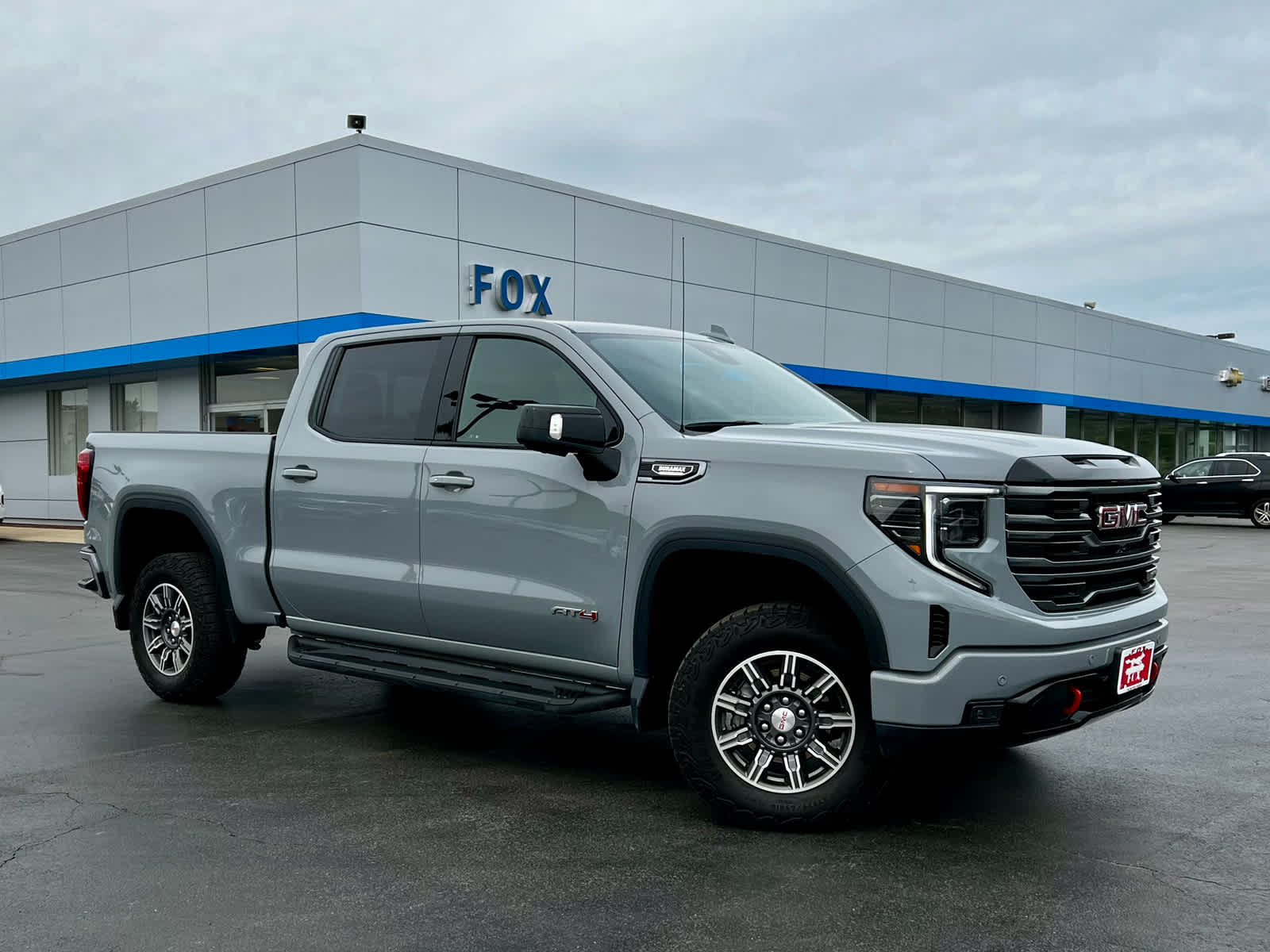 2025 GMC Sierra 1500 AT4 in Thunderstorm Gray — front three-quarter view